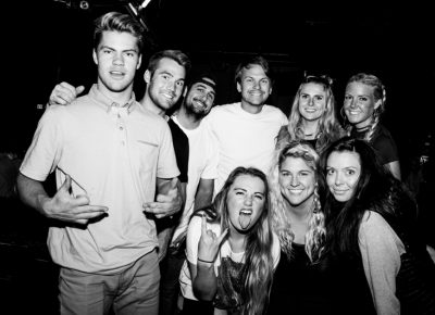 (L–R) Jim, Nate, Ryan, Xach, Kristen, Lo, Sporty, Laci and Miss gather for a group shot before The Sounds' set. Photo: Gilbert Cisneros