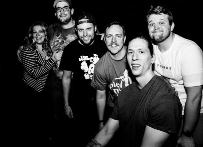 (L–R) Nadia, Scott, Austin, Erick, Robert and Jordan pose for a quick picture after The Sounds' set. Photo: Gilbert Cisneros