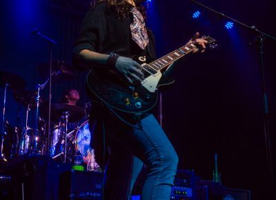 As the cool blue lights cast themselves onto the crowd, Derek Day warms their spirits with his grungy rock music. Photo: Talyn Sherer