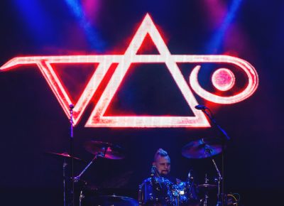 Jeremy Colson rests easy at center stage under the signature Steve Vai logo. Photo: Talyn Sherer