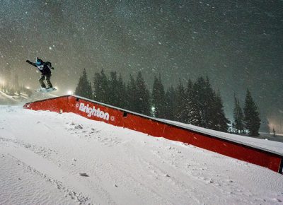 Local Salt Lake snowboarder Jonah Car Michael hit the boxes at the well-lit terrain park, accessible by the Majestic Lift. Photo: Jo Savage // @SavageDangerWolf