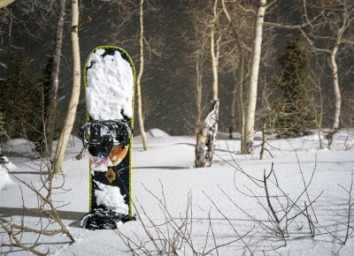 The snowboard waited patiently in soft, deep and fluffy pow while its rider photographed the terrain park. Photo: Jo Savage // @SavageDangerWolf