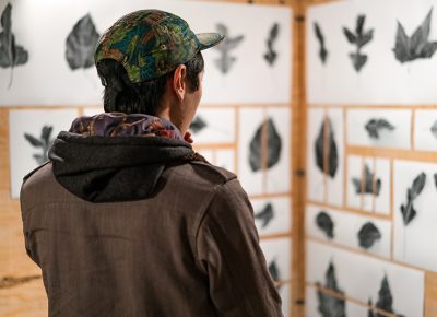 This attendee checked out the leaf art done by Alexis Hansen. Photo: Jo Savage // @SavageDangerWolf