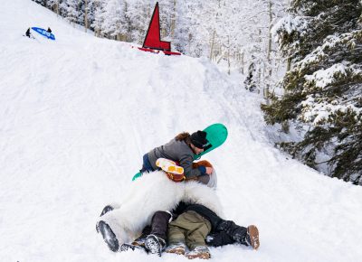 People dog piled Makalu Arnold after he was announced the winner of the Men’s Open Snow. Yeti got in on it too. Photo: Jo Savage // @SavageDangerWolf