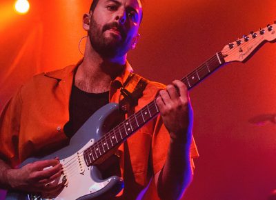 Eric Cannata of Young the Giant sports the blue Fender guitar that is a staple in the music industry. Photo: Talyn Sherer.