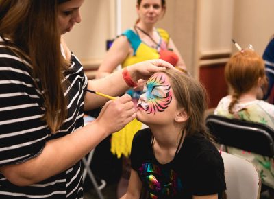 Con attendee Zoey and her mother Jennifer (not pictured) enjoy the face painting at Kid Con inside FanX17. Photo: Lmsorenson.net