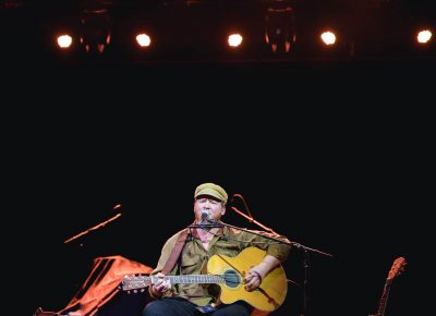 Dylan Walshe playing a lone performance, opening for Flogging Molly. Photo: Lmsorenson.net