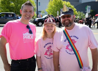 (L–R) John Ford, Cooper Riekhof and Barton Moody wait to march in the parade. Ford is SLUG’s Community Development Manager, and he served as SLUG’s parade marshal. “There’s unity here like no place else,” Moody said. Photo: John Barkiple