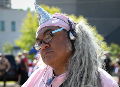 Leroy Te’o helped carry the SLUG Magazine banner during the pride parade. Photo: John Barkiple