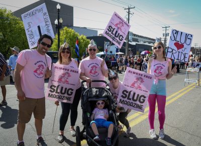 (L–R) Dana Naideth, Lori Love, Dean O Hillis, Audrey Naideth and Claire Love prepare to steer Whitney’s stroller along the parade route. Photo: John Barkiple