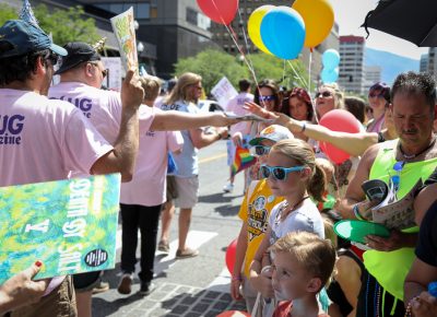 SLUG Magazine staff and friends pass out magazines along the parade route. Photo: John Barkiple