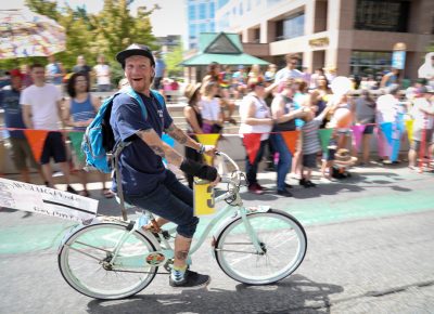 Parker takes laps around marching SLUG staffers on his $15 bike. He’ll often park it up in a tree outside the Jackalope Lounge. Photo: John Barkiple