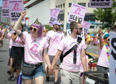 (L–R) Heather Mahler and Eric Taylor bring a little romantic activism to the pride parade. Photo: John Barkiple