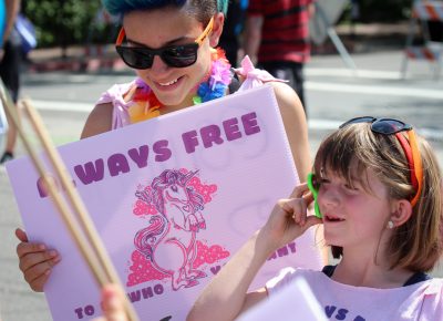 (L–R) Giggly Quincy Koons and fidgety Alice keep it silly in the Pride Parade. Photo: John Barkiple