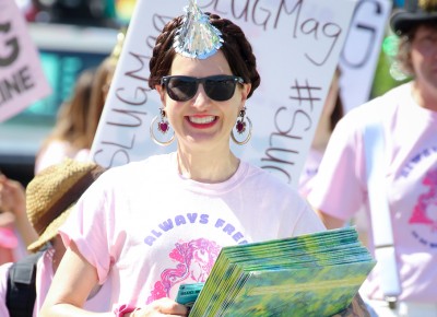 SLUG Magazine Executive Editor Angela H. Brown passes out vinyl copies of Death by Salt Vol. 5, a SLUG-curated compilation of Salt Lake’s local music. Photo: John Barkiple