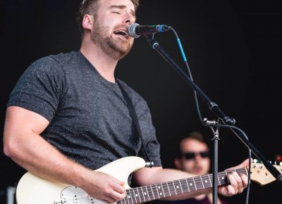 RKDN lead vocalist and guitarist playing at Ogden Twilight Concert Series. Photo: Lmsorenson.net