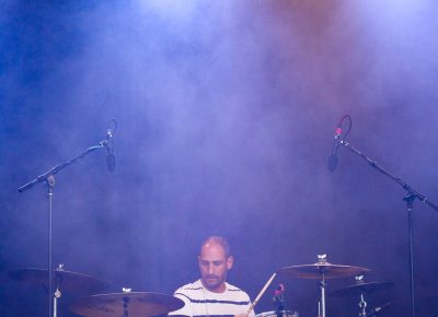 Surrounded by fog, Dan Konopka plays at the rear of the stage. Photo: LmSorenson.net