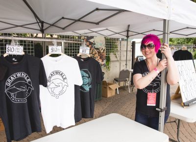 Ruby Barnes from Graywhale Entertainment setting up the merch tent at Ogden Twilight. Photo: Lmsorenson.net