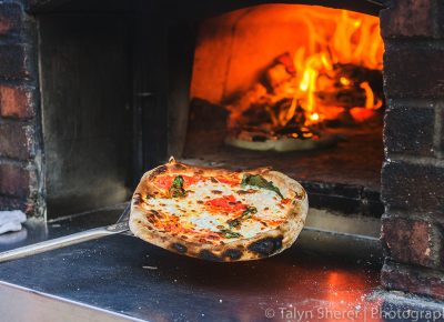 Fire & Slice Wood Pizza had me practically diving into their wood-burning oven to taste a piece of their margherita pizza topped with rosemary olive oil. Photo: Talyn Sherer