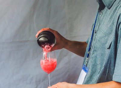 Takashi shows us their cocktail game with the “Smile Jamaica,” featuring Kirk and Sweeney 18-year rum, Campari and hibiscus tea. Photo: Talyn Sherer