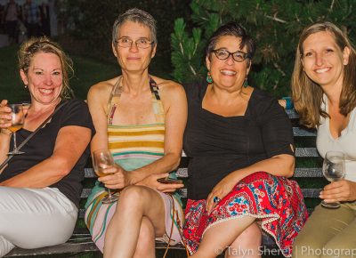 (L–R) Ginger Steensma, Sally Padawer, Amy Martin and Aurelie Ferrut wind down the night with a glass of white wine on a park bench. Photo: Talyn Sherer