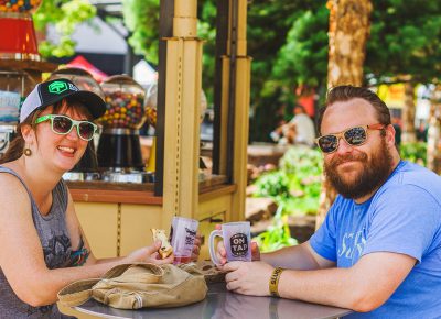 (L–R) Emily Park and Bryant Gordon chill in the shade and converse over their favorite beers. Photo: Talyn Sherer