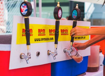 RPM Brewery pours up an frosty glass of beer for their thirsty crowd of diehard fans. Photo: Talyn Sherer