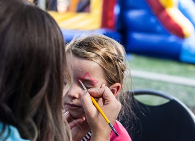 Annie gets an awesome face-painting job in the Kids Area. Photo: Chris Gariety