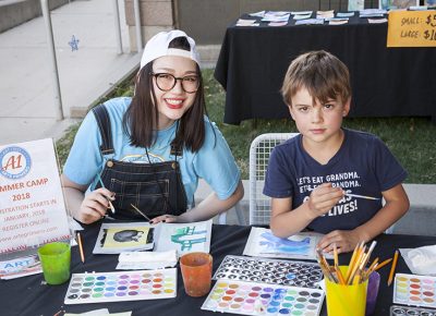 A young girl and a little boy paint side by side. Photo: @jbunds