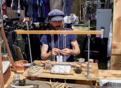 Logan Olsen, owner of Cedar and Rye, setting up for the last day of the 9th Annual Craft Lake City DIY Festival. @cezaryna