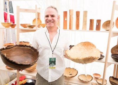 Alan Peck of Peck’s Vanilla displays some custom wooden bowls with handmade wooden salt grinders behind. LmSorenson.net