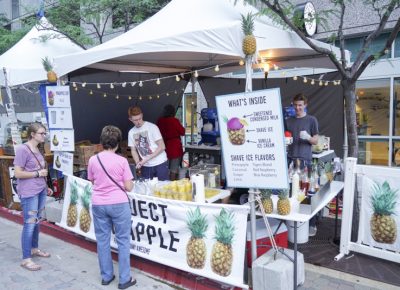 Customers cooling off with a pineapple shaved ice. Photo: @jaysonrossphoto