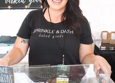 Sprinkle and Dash owner Amanda Andersen showing off her delicious macaron cookie display. LmSorenson.net