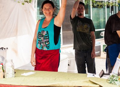 Alyssa of Chef Cantu holds on to her tent during the high winds on Sunday. Photo: Chris Gariety