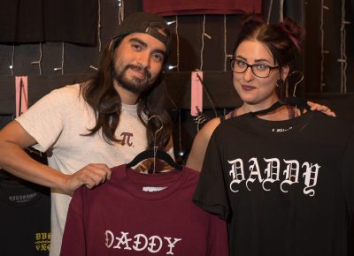 (L–R) Jake Romero has his eye on the hats at Gold Blood, and Brandy May wants a DRUX nylon shell. Photo: John Barkiple