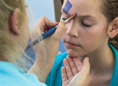 A little girl receives a free David Bowie–inspired face painting in the Kids' Area. Photo: @colton_marsala