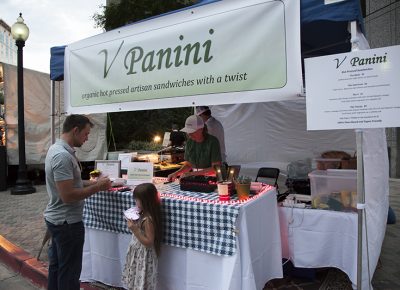 A man and his daughter pay for their food from V Panini. Photo: @jbunds