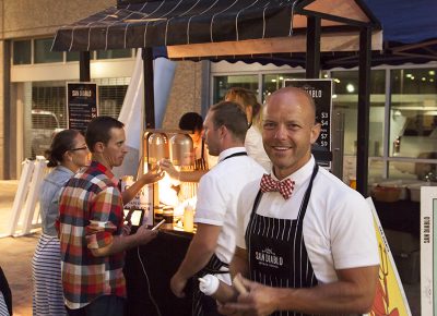 A San Diablo Artisan Churros representative offers samples of their special caramel sauce. Photo: @jbunds