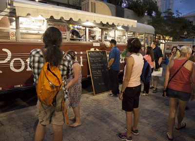 People hover around the Pizza Bus in anticipation for pizza! Photo: @jbunds