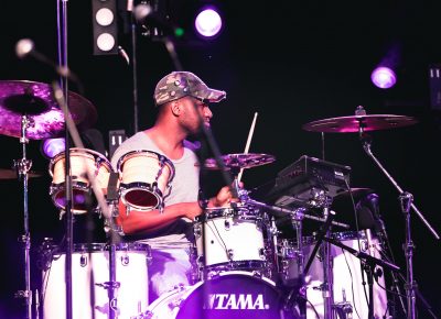 Touring drummer playing backup rhythms for Trombone Shorty. Photo: Lmsorenson.net