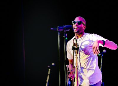 Troy Andrews providing vocals for the performance at Red Butte. Photo: Lmsorenson.net