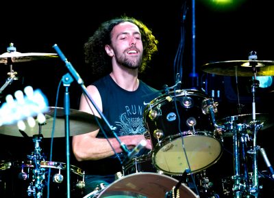 Drummer Joey Peebles hammering in the beat for the audience to rock to. Photo: Lmsorenson.net