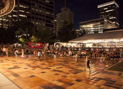 Children play and their parents watch while waiting for the band Joshy Soul and the Cool to set up. Photo: @jbunds