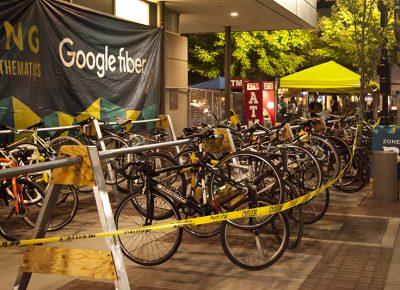 Bikes hang from racks at the bike valet near the north end entrance to the festival. Photo: @jbunds