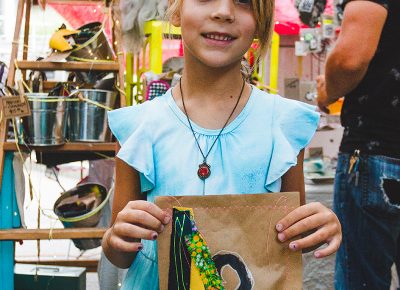 Josie Flickinger is excited to see what her mystery bag from Parker Rose Merc contains. Photo: @taylnshererphoto