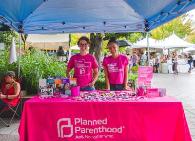 (L–R) PPAU volunteers Flow Doval and Natasha Wong supply CLC patrons with all the necessary information and tools to practice safe sex. Photo: @taylnshererphoto