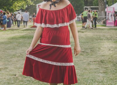 Madi Whitaker in a red dress and bandana. Photo: @clancycoop