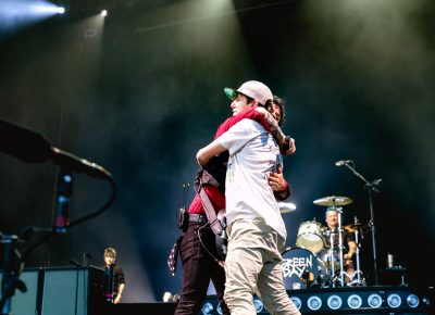 Billie Joe Armstrong embraces a fan picked out from the crowd to join him onstage. Photo: Lmsorenson.net