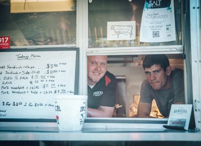 (L–R) Bryan and Kyle serving the fine brisket from Bandera. They smoke their meat for over 12 hours and use family recipes from Texas. Good stuff. Photo: johnnybetts.com