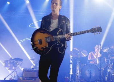 Mark Foster of Foster the People grabs a new guitar for the next song. Photo: Lmsorenson.net